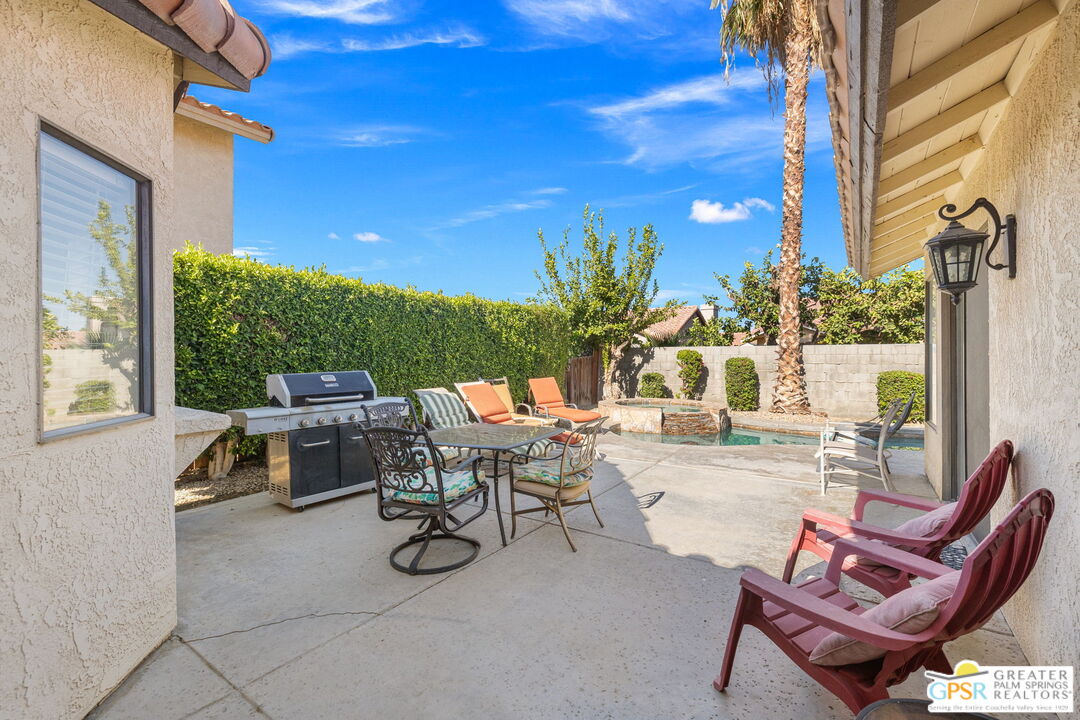 45688 Sutter Creek Road Indio, CA 92201 - Photo 40 of 51 a view of a patio with chairs and tables
