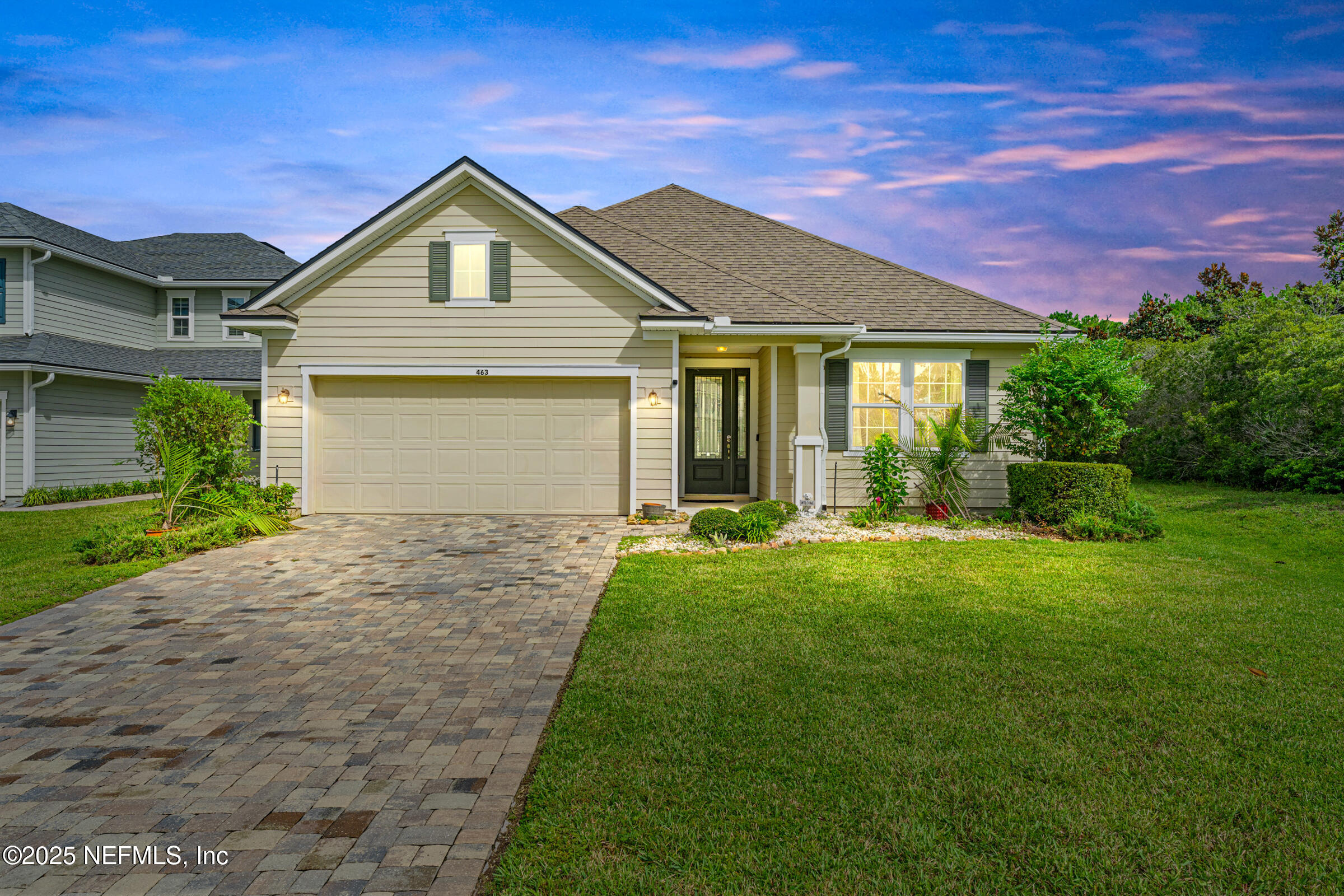 a front view of a house with a yard