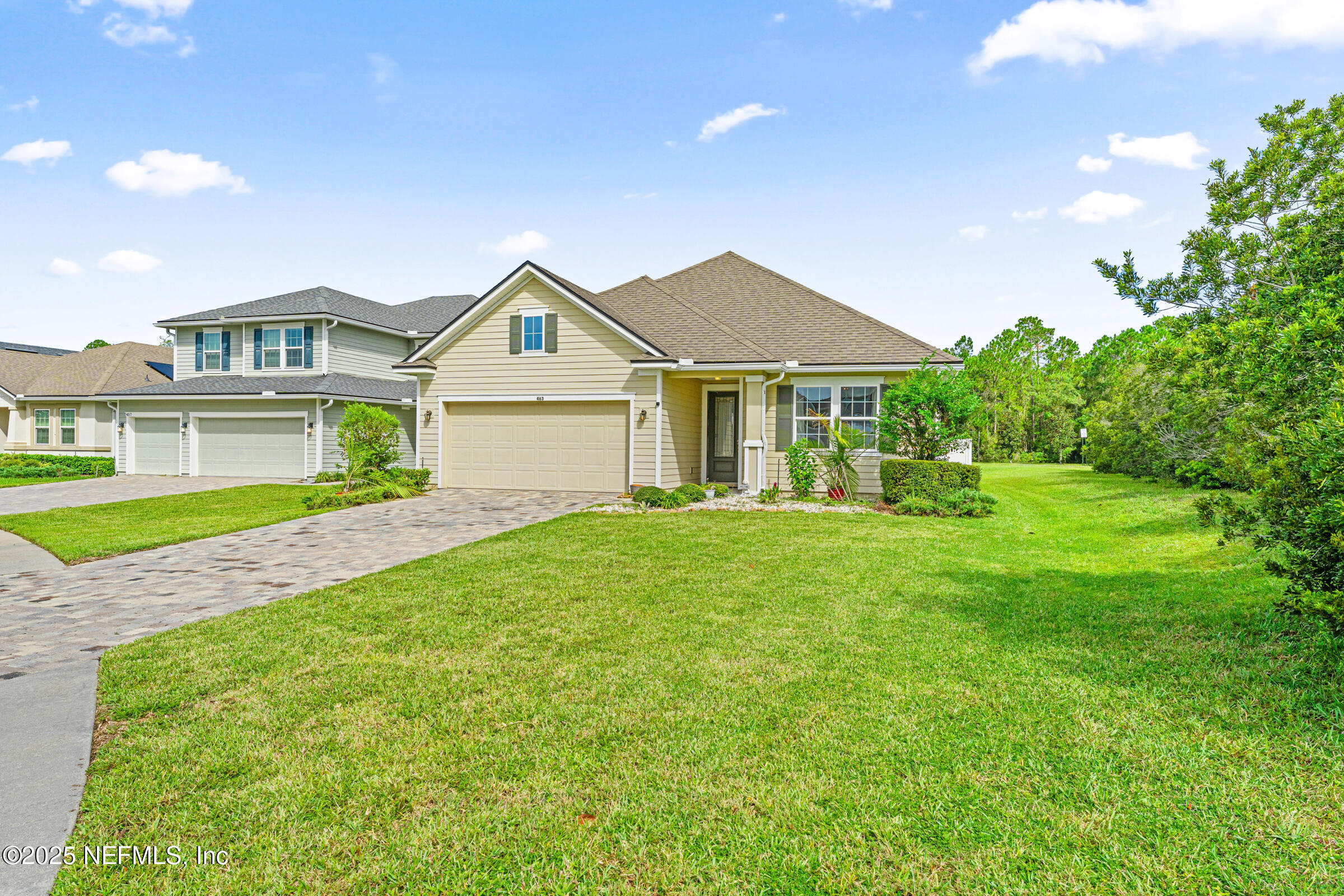 463 Tumbled Stone Way St. Augustine, FL 32086 - Photo 12 of 71 a front view of a house with a yard