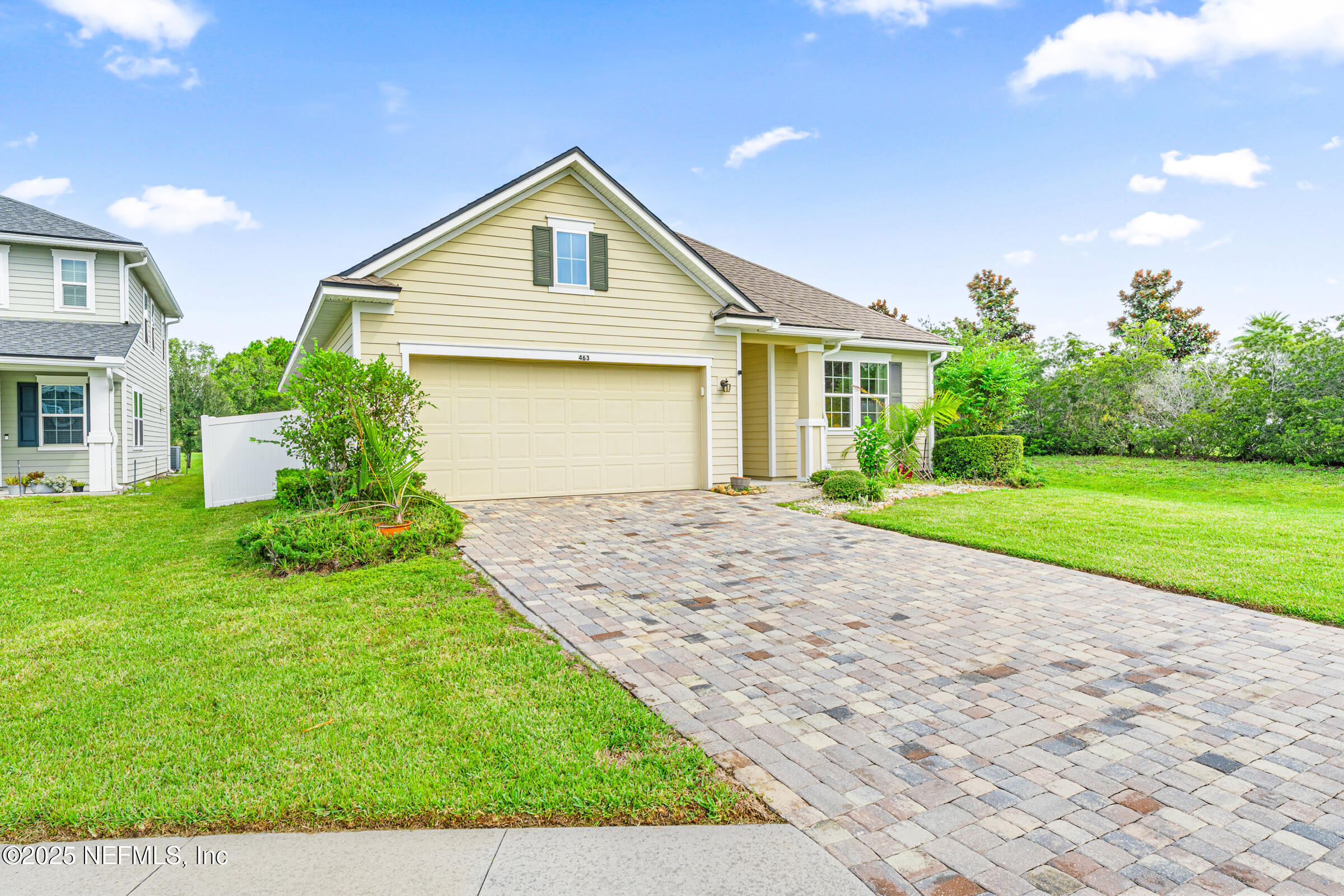 463 Tumbled Stone Way St. Augustine, FL 32086 - Photo 13 of 71 a front view of a house with a yard and garage