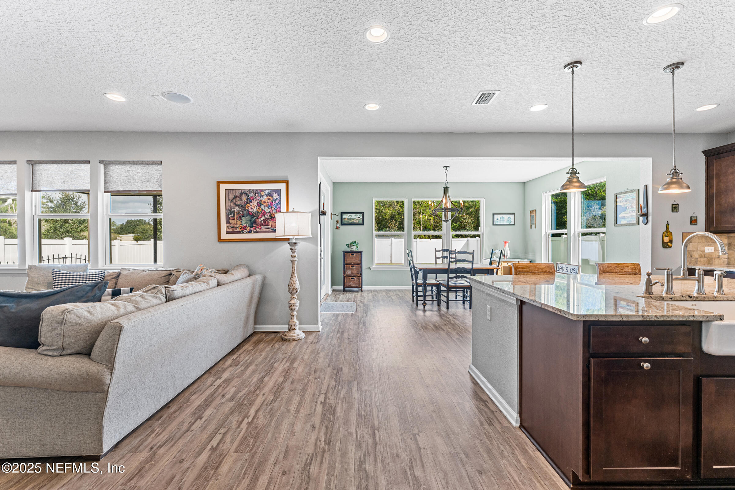 463 Tumbled Stone Way St. Augustine, FL 32086 - Photo 18 of 71 a living room with furniture and wooden floor