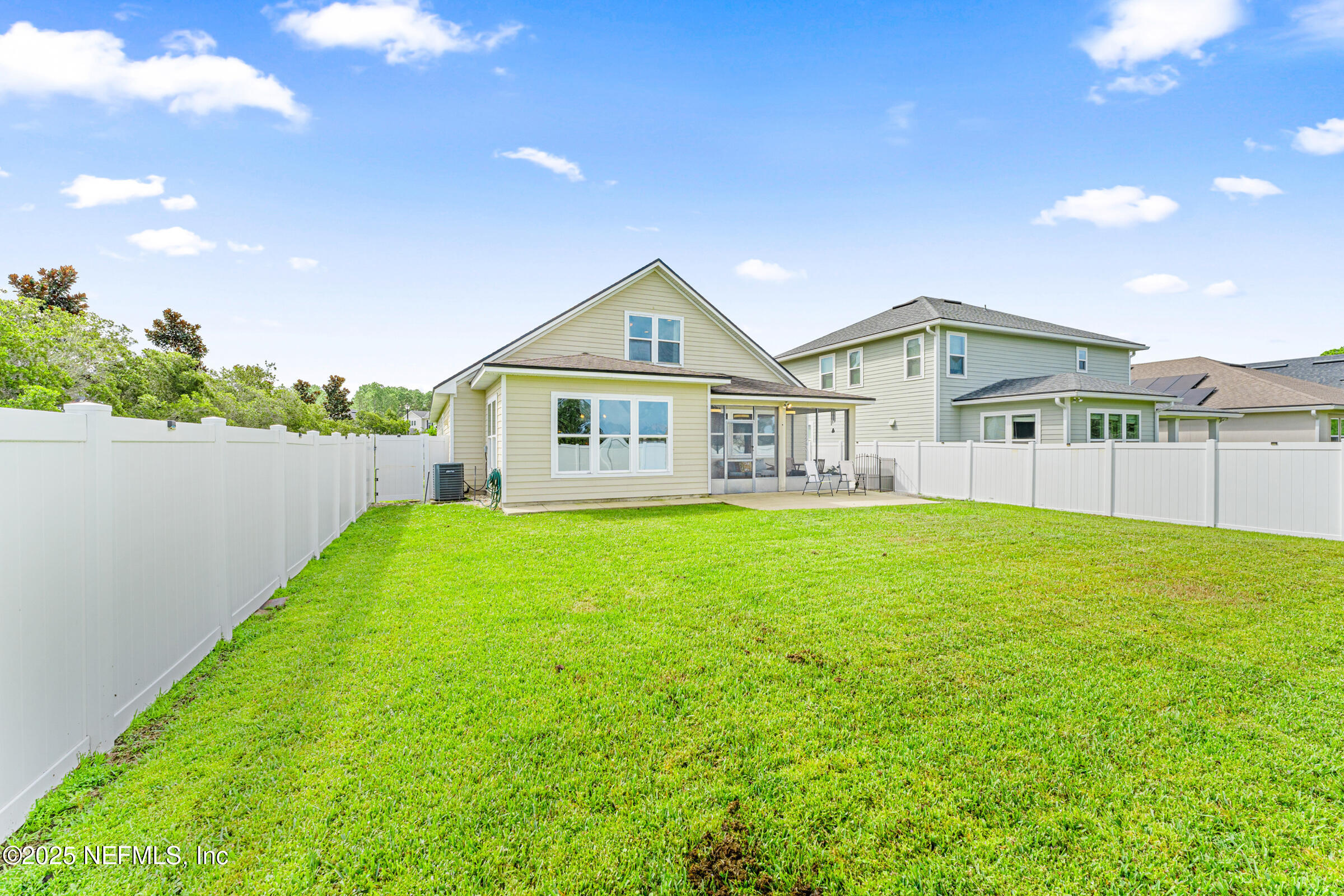 463 Tumbled Stone Way St. Augustine, FL 32086 - Photo 29 of 71 a front view of a house with a garden and yard