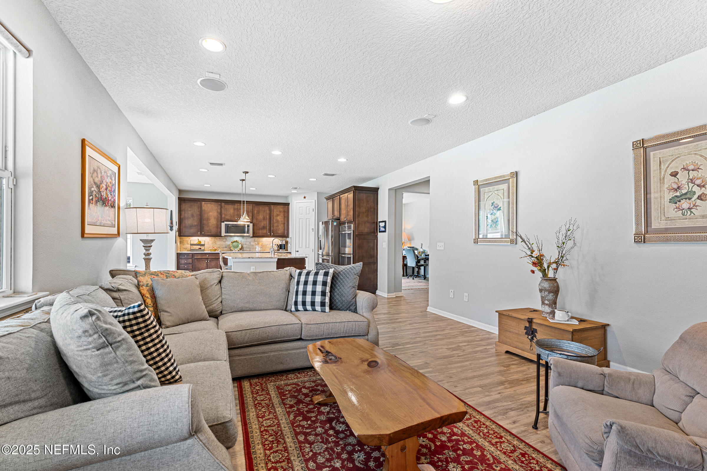 463 Tumbled Stone Way St. Augustine, FL 32086 - Photo 33 of 71 a living room with furniture and wooden floor