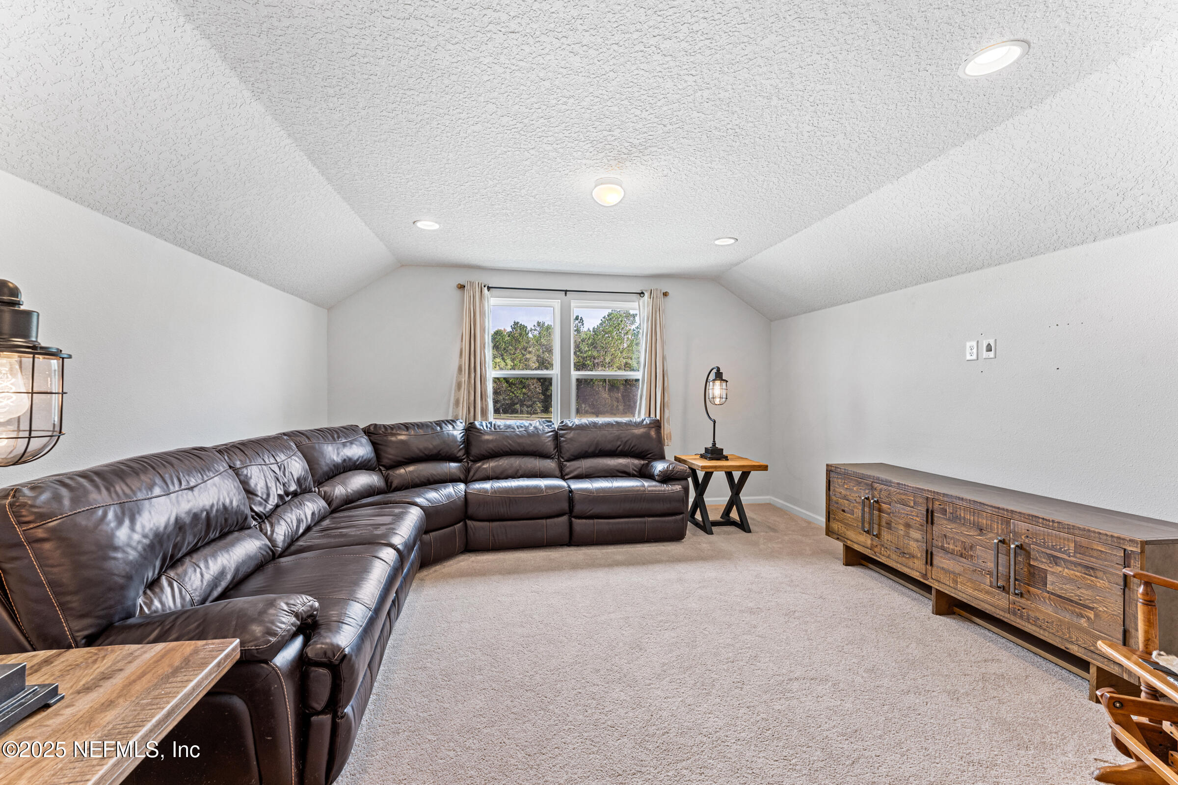463 Tumbled Stone Way St. Augustine, FL 32086 - Photo 35 of 71 a living room with furniture and a window