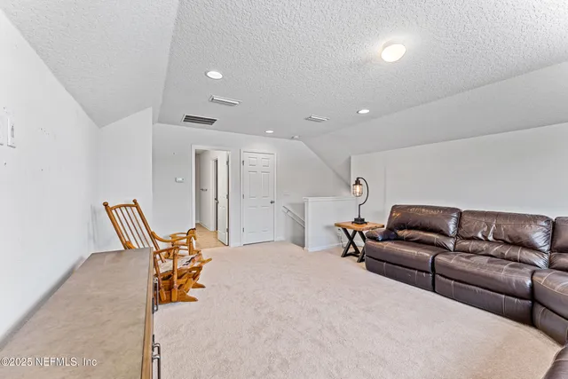 an aerial view of a house with a swimming pool yard and outdoor seating