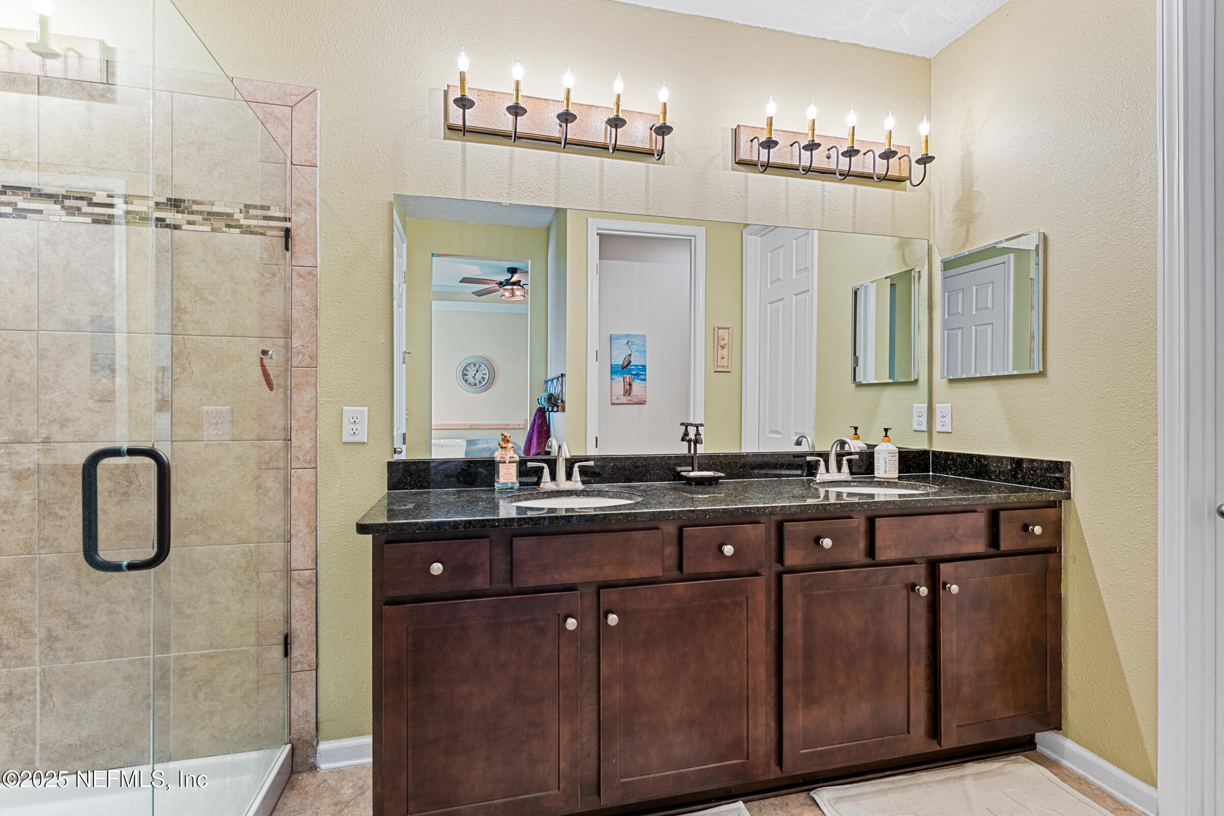 463 Tumbled Stone Way St. Augustine, FL 32086 - Photo 41 of 71 a bathroom with double vanity and a mirror