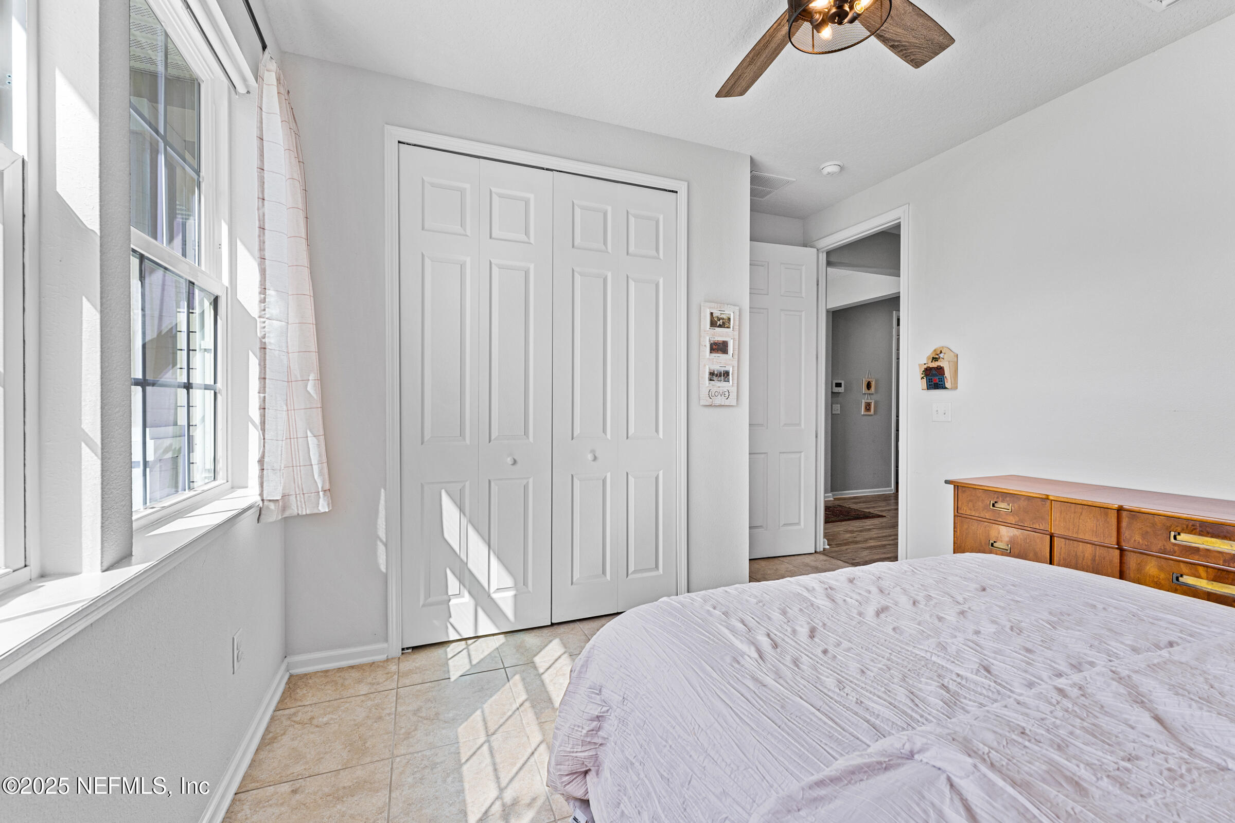 463 Tumbled Stone Way St. Augustine, FL 32086 - Photo 44 of 71 a bedroom with a bed and a window