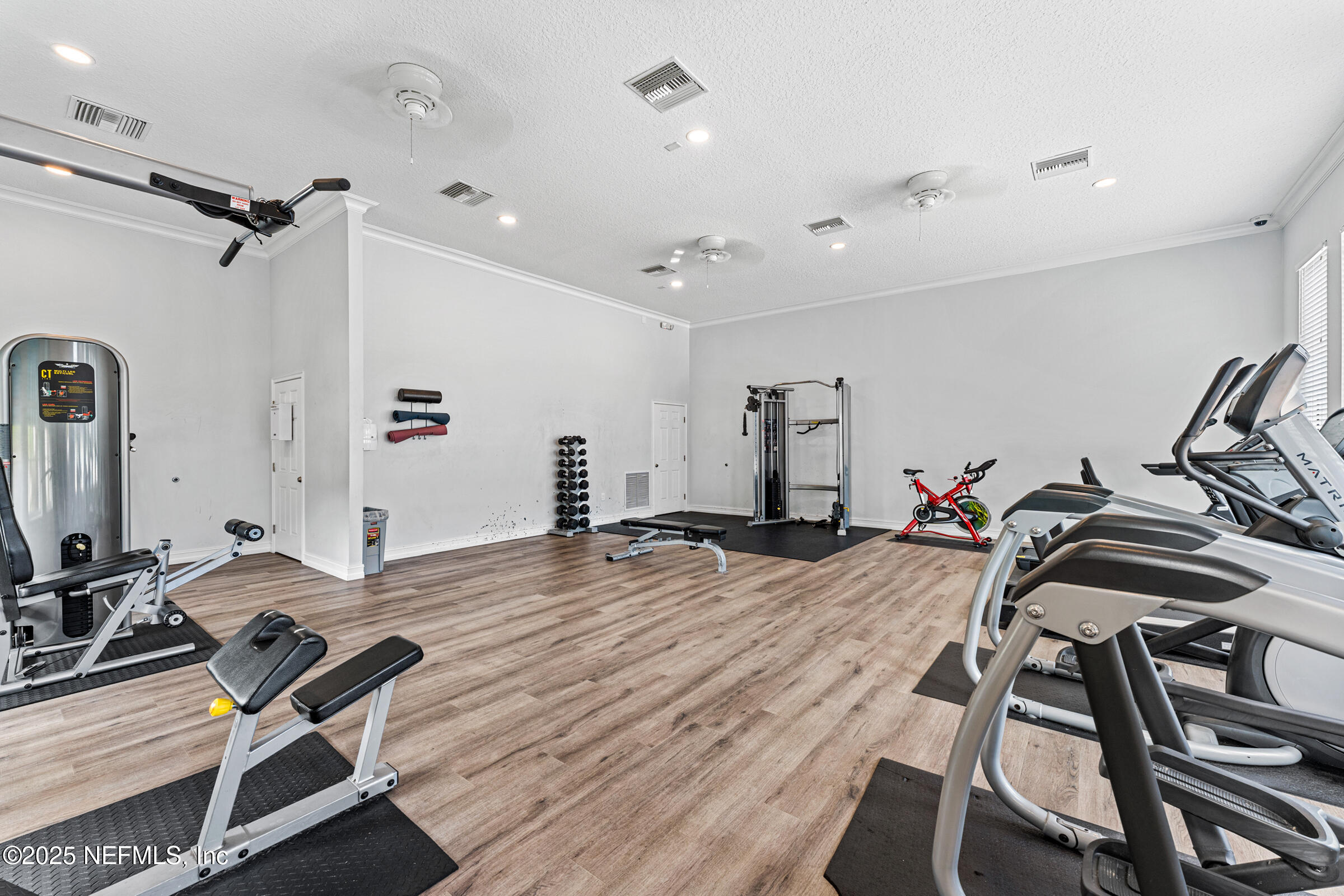 463 Tumbled Stone Way St. Augustine, FL 32086 - Photo 62 of 71 a view of a room with gym equipment