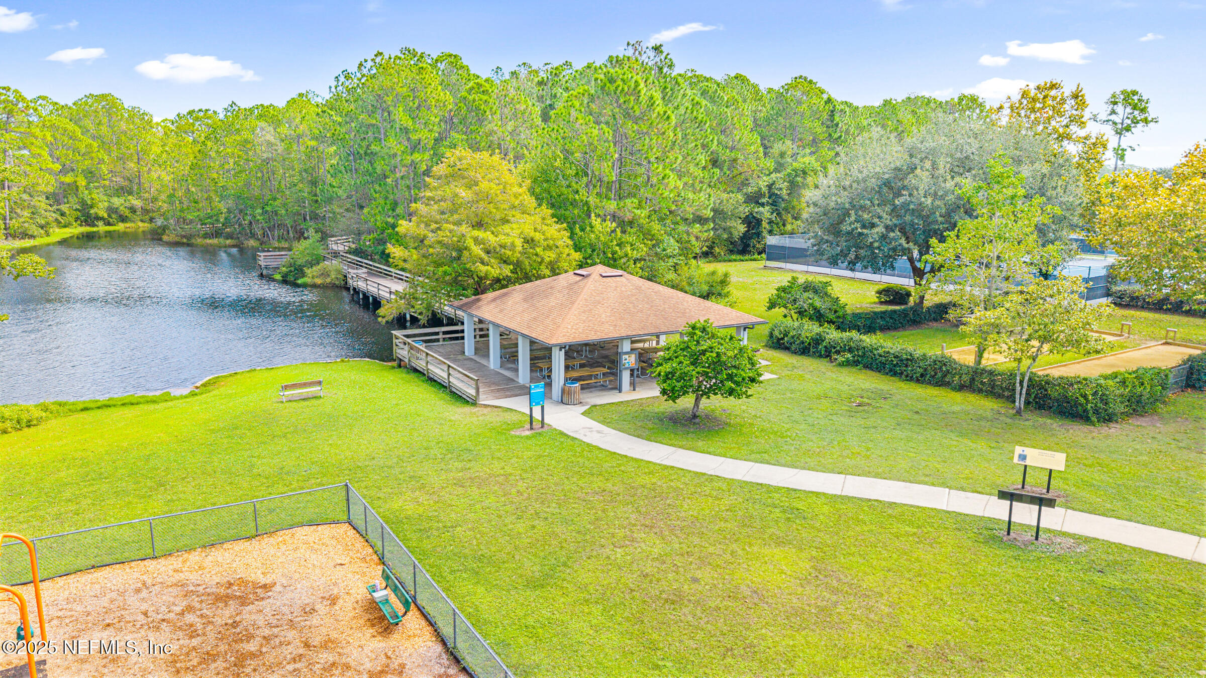 463 Tumbled Stone Way St. Augustine, FL 32086 - Photo 66 of 71 a view of a swimming pool with an outdoor seating and yard