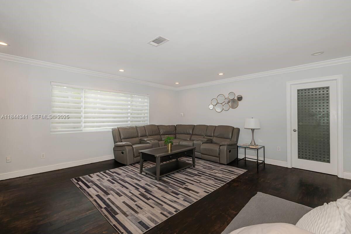 7475 Southwest 134th Street Pinecrest, FL 33156 - Photo 11 of 42 a living room with furniture and a window