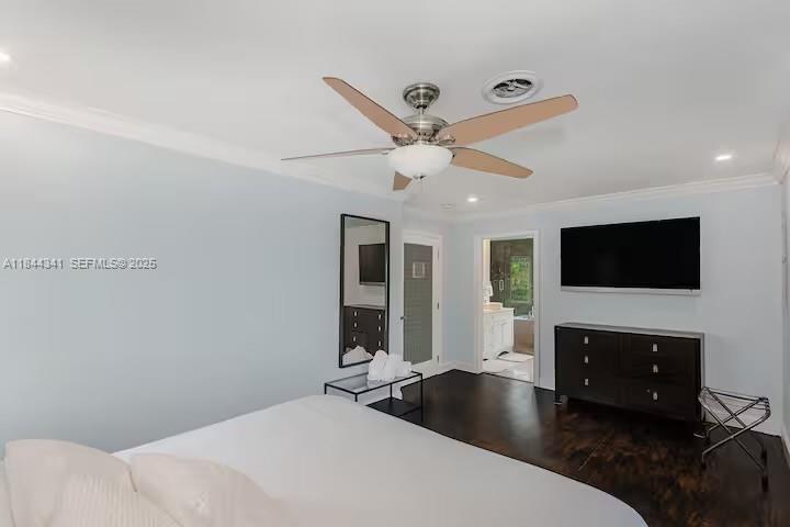 7475 Southwest 134th Street Pinecrest, FL 33156 - Photo 14 of 42 a bedroom with a bed and a flat screen tv