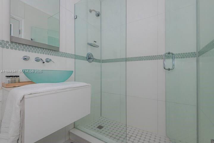 7475 Southwest 134th Street Pinecrest, FL 33156 - Photo 23 of 42 a bathroom with a shower and a sink