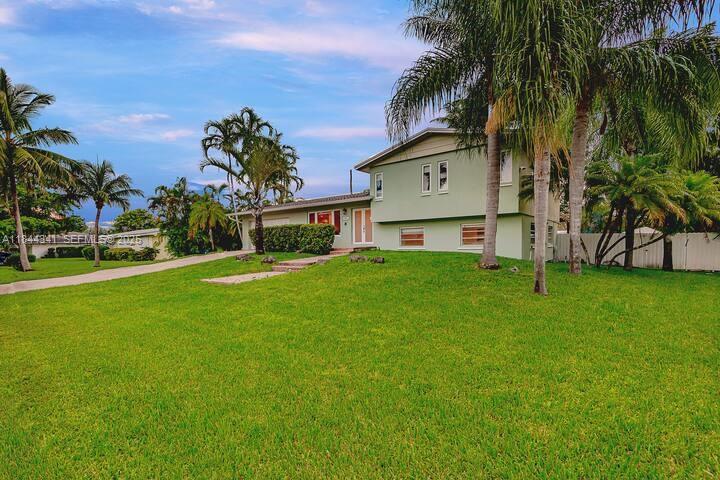 7475 Southwest 134th Street Pinecrest, FL 33156 - Photo 38 of 42 a view of a house with a big yard