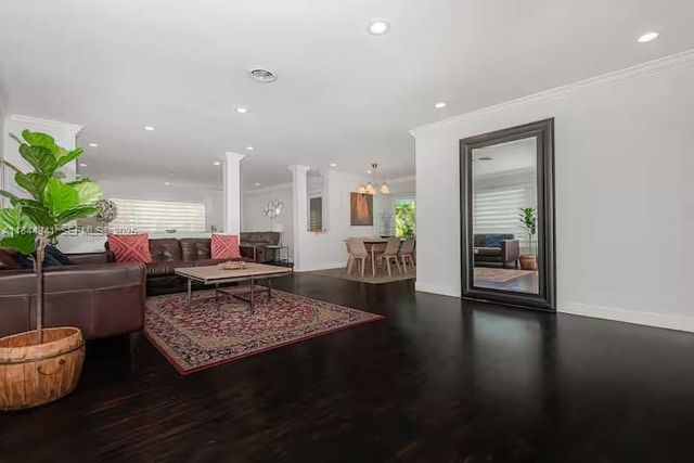 a living room with furniture and a rug