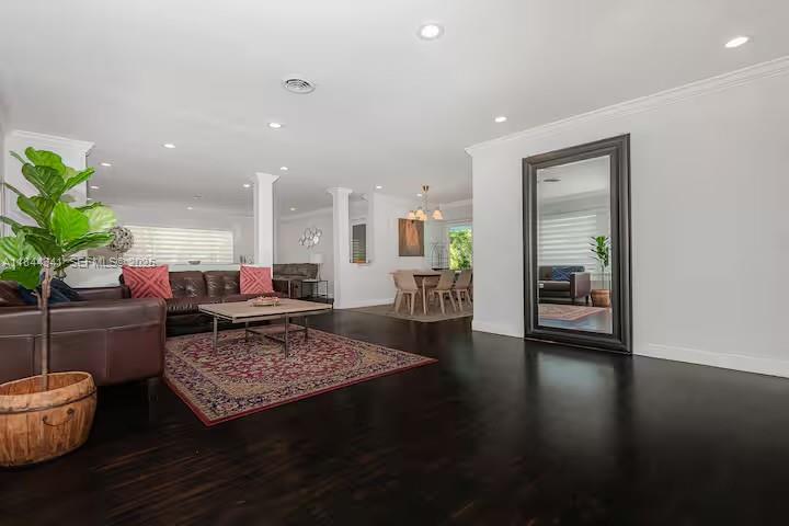 7475 Southwest 134th Street Pinecrest, FL 33156 - Photo 6 of 42 a living room with furniture and a rug