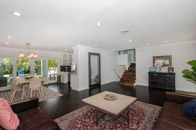 a living room with furniture and a rug