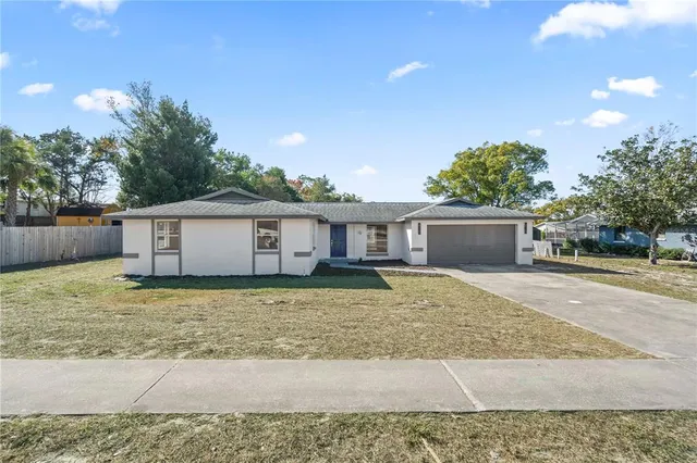 a house view with a backyard space