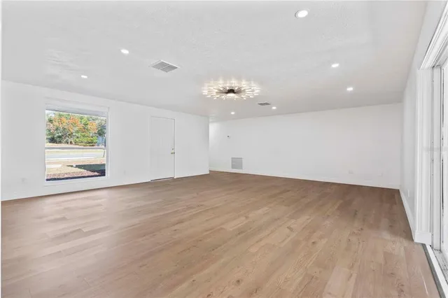 a view of an empty room with a window