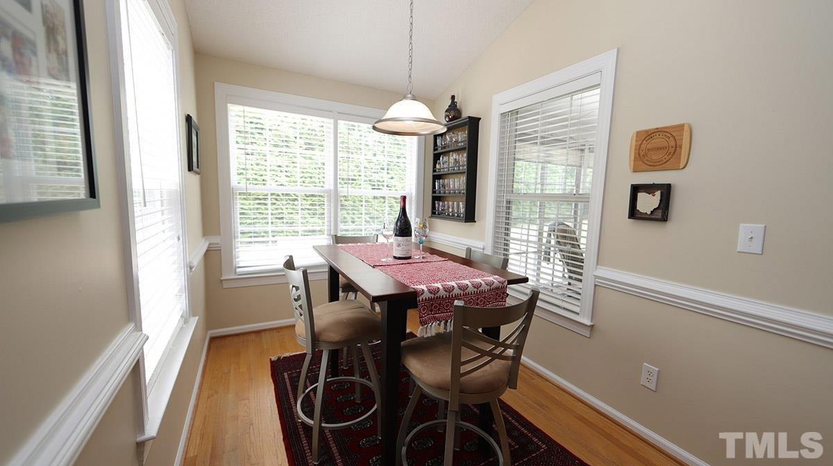 3820 Evander Way Raleigh, NC 27613 - Photo 14 of 30 The breakfast room is light filled with windows on 3 sides.