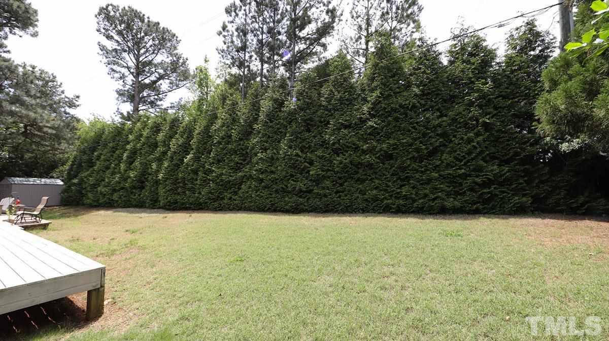 3820 Evander Way Raleigh, NC 27613 - Photo 30 of 30 The fenced backyard is great for relaxing or playing. There is a shed in the back left corner.
