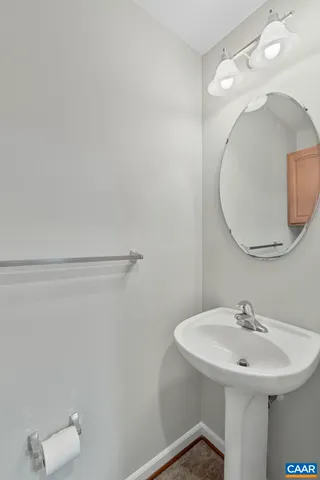 a bathroom with a sink and mirror