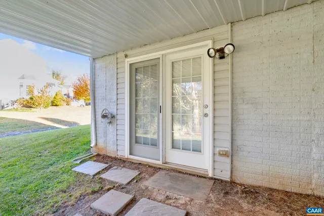 a view of a chairs and table in a patio