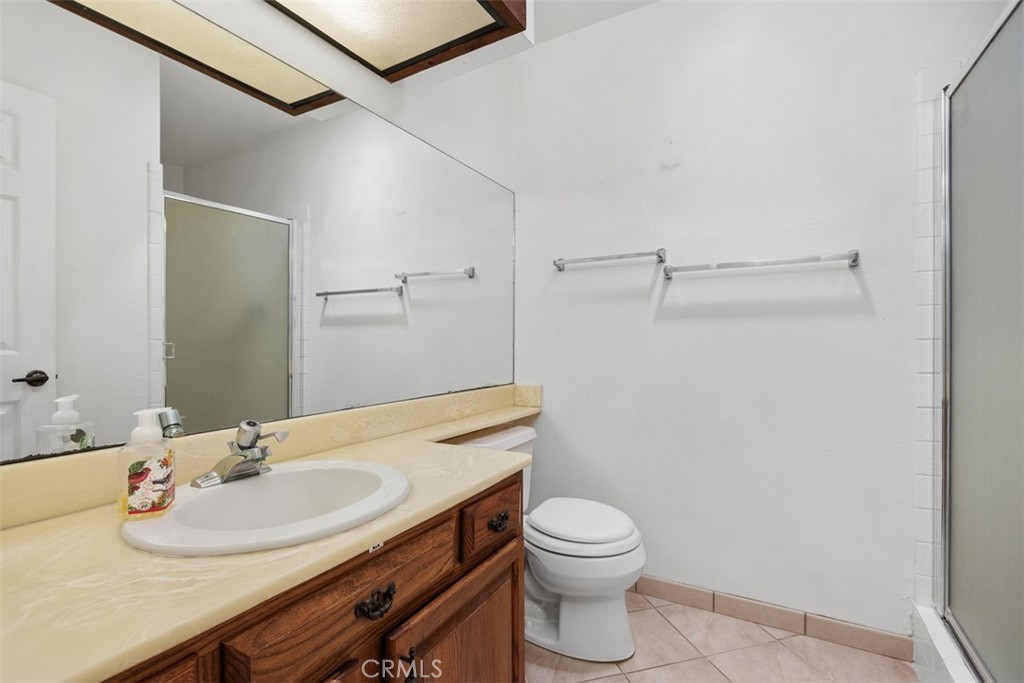 1744 Woodlark Lane Fallbrook, CA 92028 - Photo 28 of 38 a bathroom with a sink toilet and shower