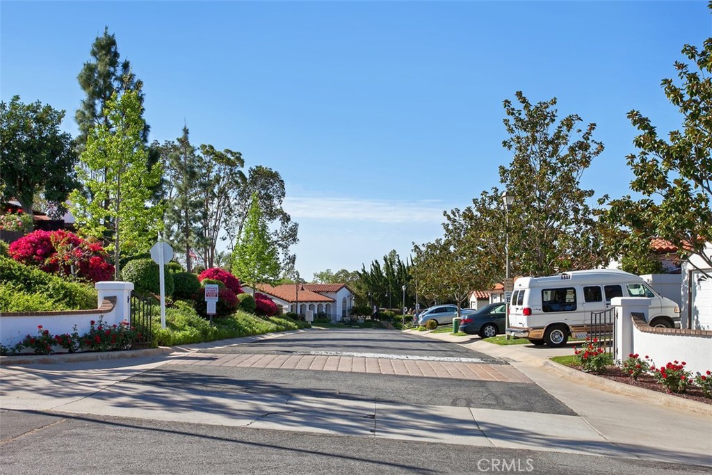 1744 Woodlark Lane Fallbrook, CA 92028 - Photo 35 of 38 a front view of a building with garden and flowers