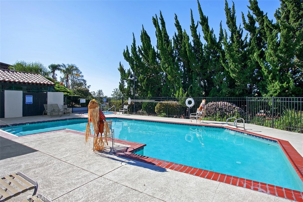 1744 Woodlark Lane Fallbrook, CA 92028 - Photo 36 of 38 a view of a backyard with swimming pool and deck