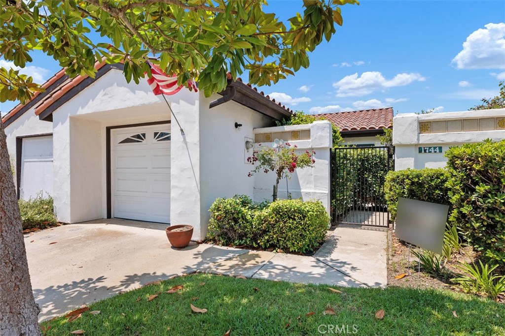 1744 Woodlark Lane Fallbrook, CA 92028 - Photo 38 of 38 a front view of a house with a yard and garage