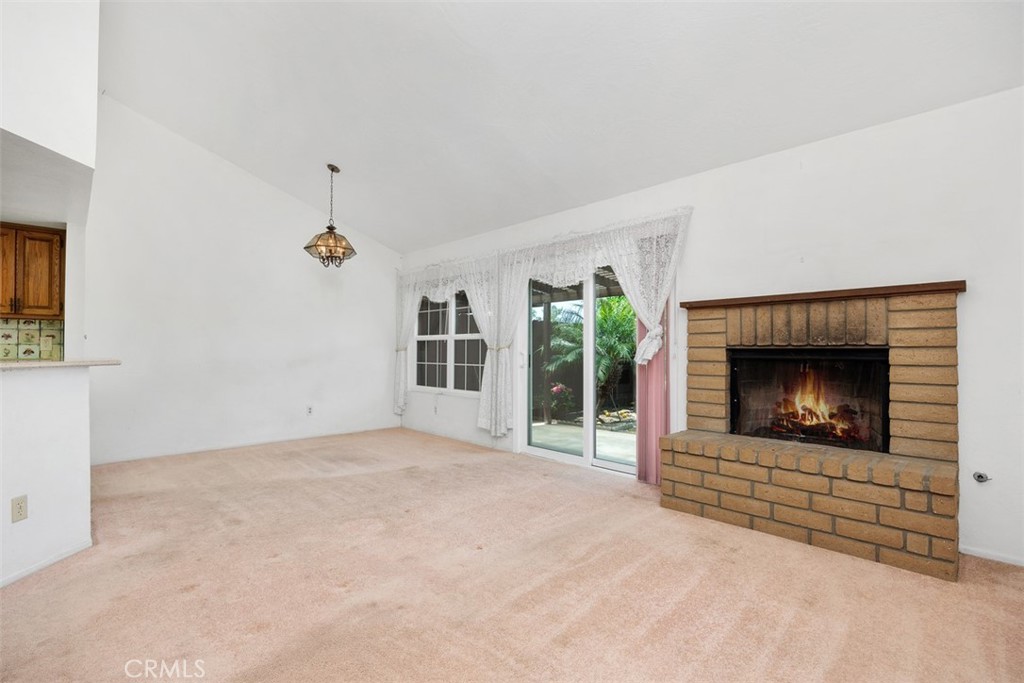 1744 Woodlark Lane Fallbrook, CA 92028 - Photo 6 of 38 an empty room with windows and fireplace