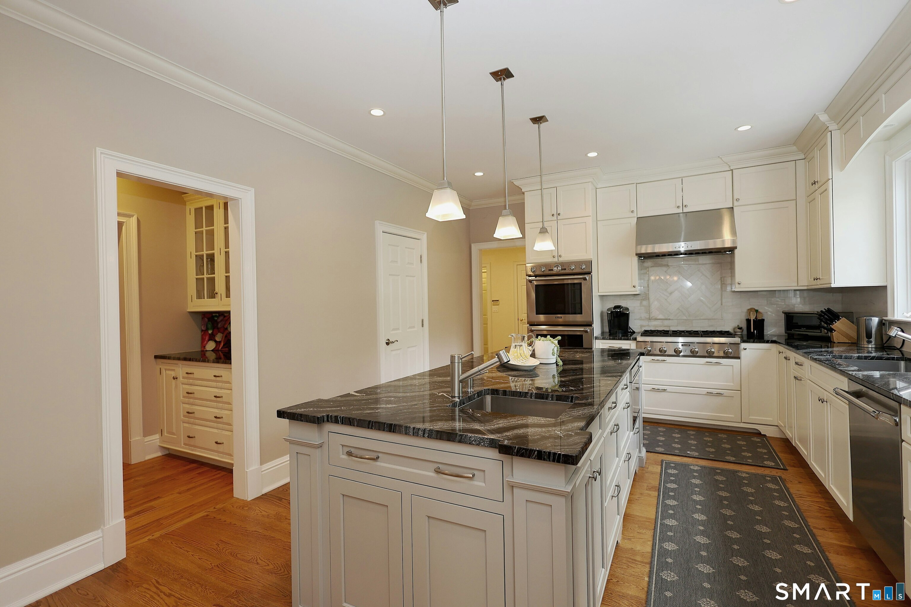 30 Whipstick Road Ridgefield, CT 06877 - Photo 21 of 40 a kitchen with counter top space cabinets and stainless steel appliances