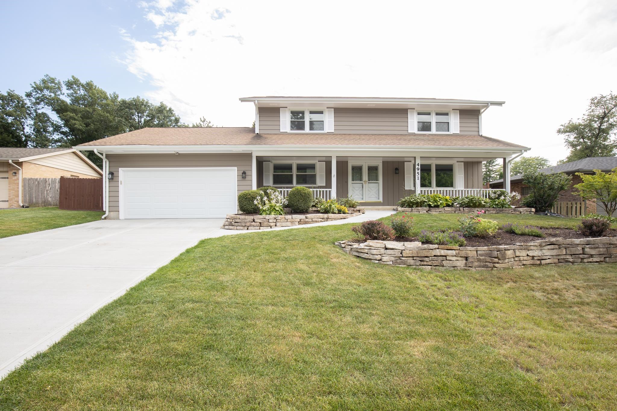 4951 Welsh Road Rockford, IL 61107 - Photo 1 of 45 a front view of a house with swimming pool and glass windows