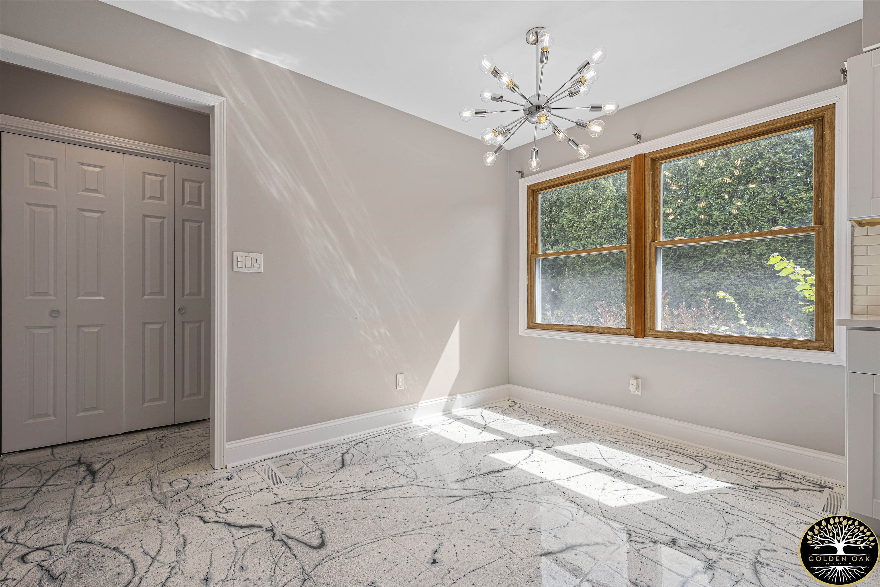 4951 Welsh Road Rockford, IL 61107 - Photo 12 of 45 a view of a livingroom with a window and a chandelier