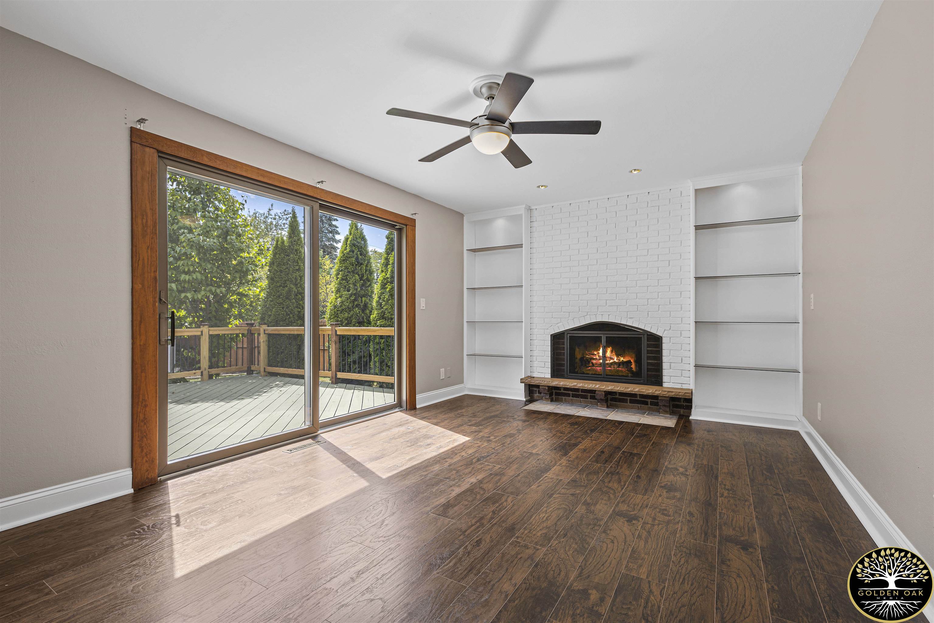 4951 Welsh Road Rockford, IL 61107 - Photo 14 of 45 a view of a livingroom with furniture wooden floor a ceiling fan and a window