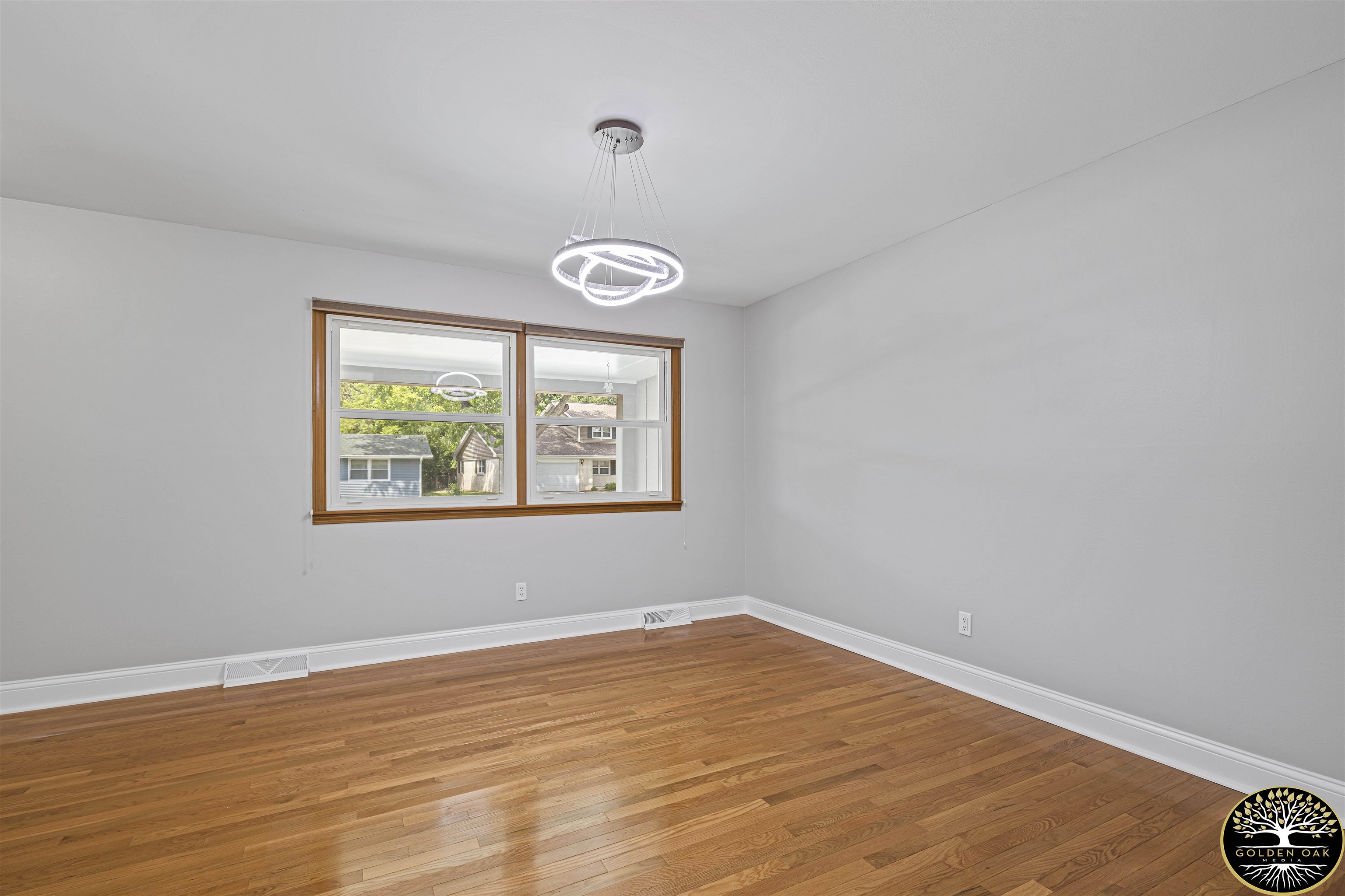4951 Welsh Road Rockford, IL 61107 - Photo 17 of 45 an empty room with wooden floor and windows