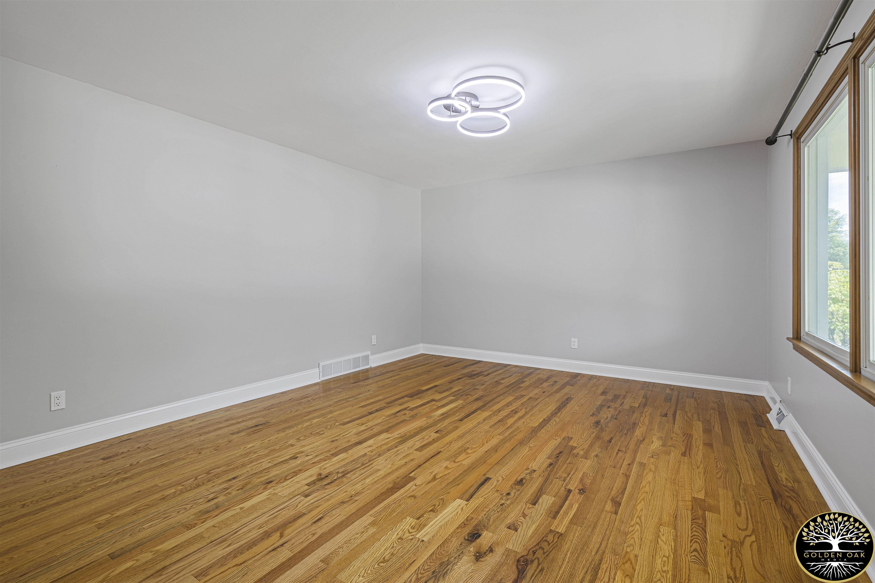 4951 Welsh Road Rockford, IL 61107 - Photo 20 of 45 a view of empty room with wooden floor and fan