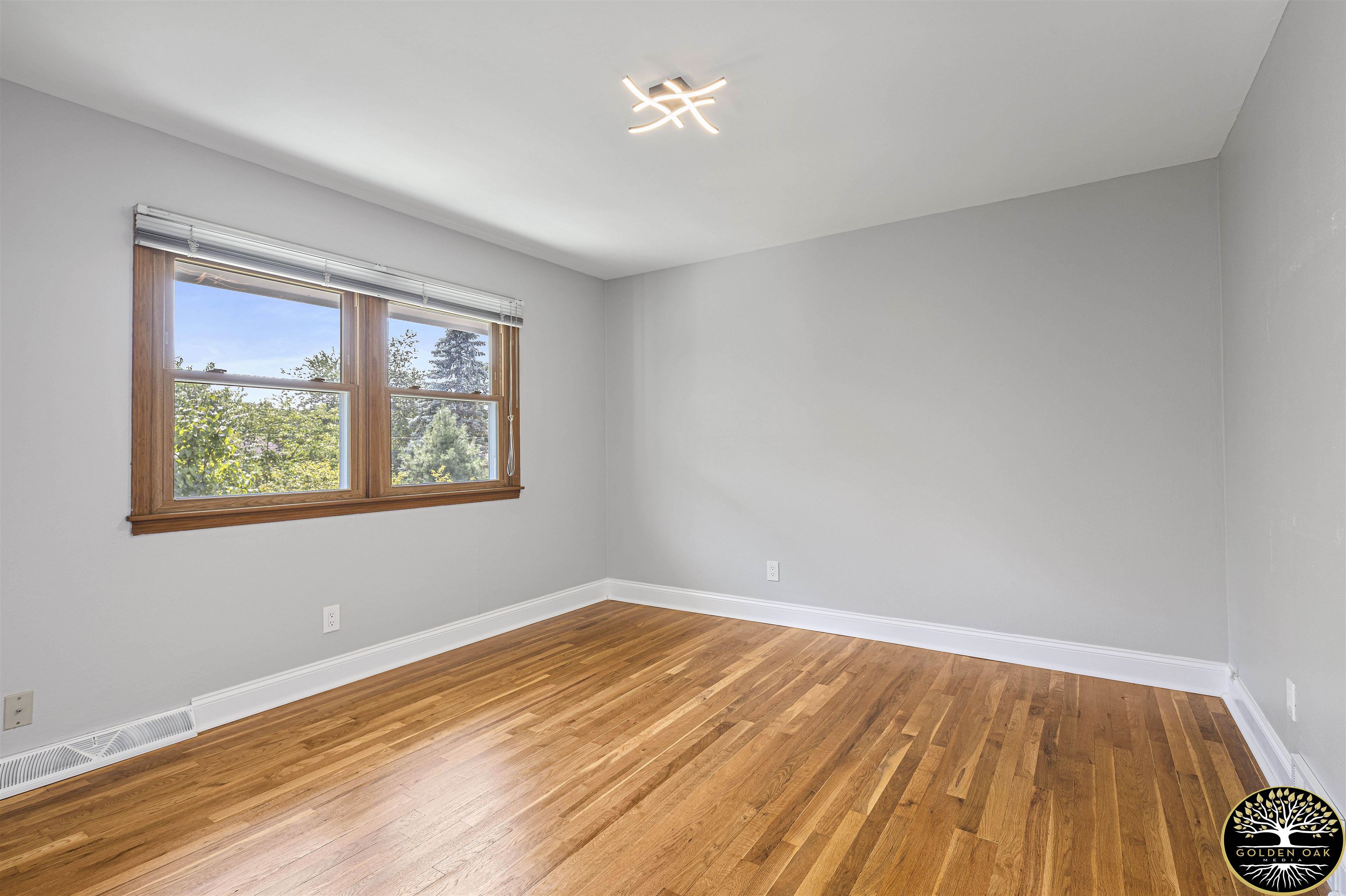 4951 Welsh Road Rockford, IL 61107 - Photo 22 of 45 a view of empty room with wooden floor and fan