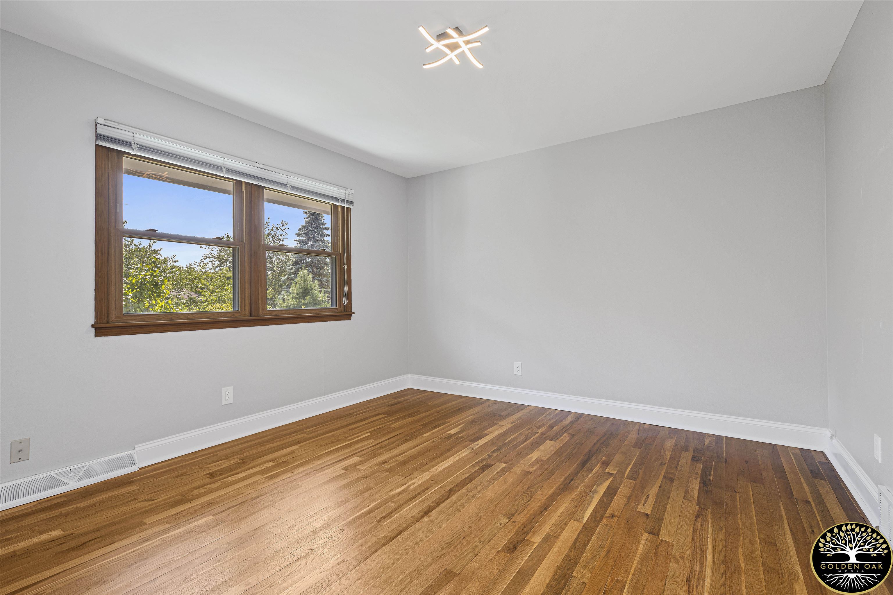 4951 Welsh Road Rockford, IL 61107 - Photo 23 of 45 a view of empty room with wooden floor and fan