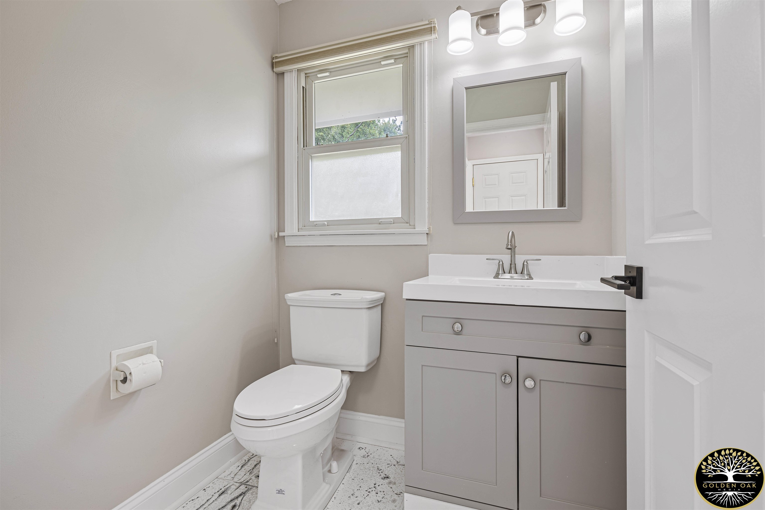 4951 Welsh Road Rockford, IL 61107 - Photo 28 of 45 a bathroom with a sink toilet and vanity