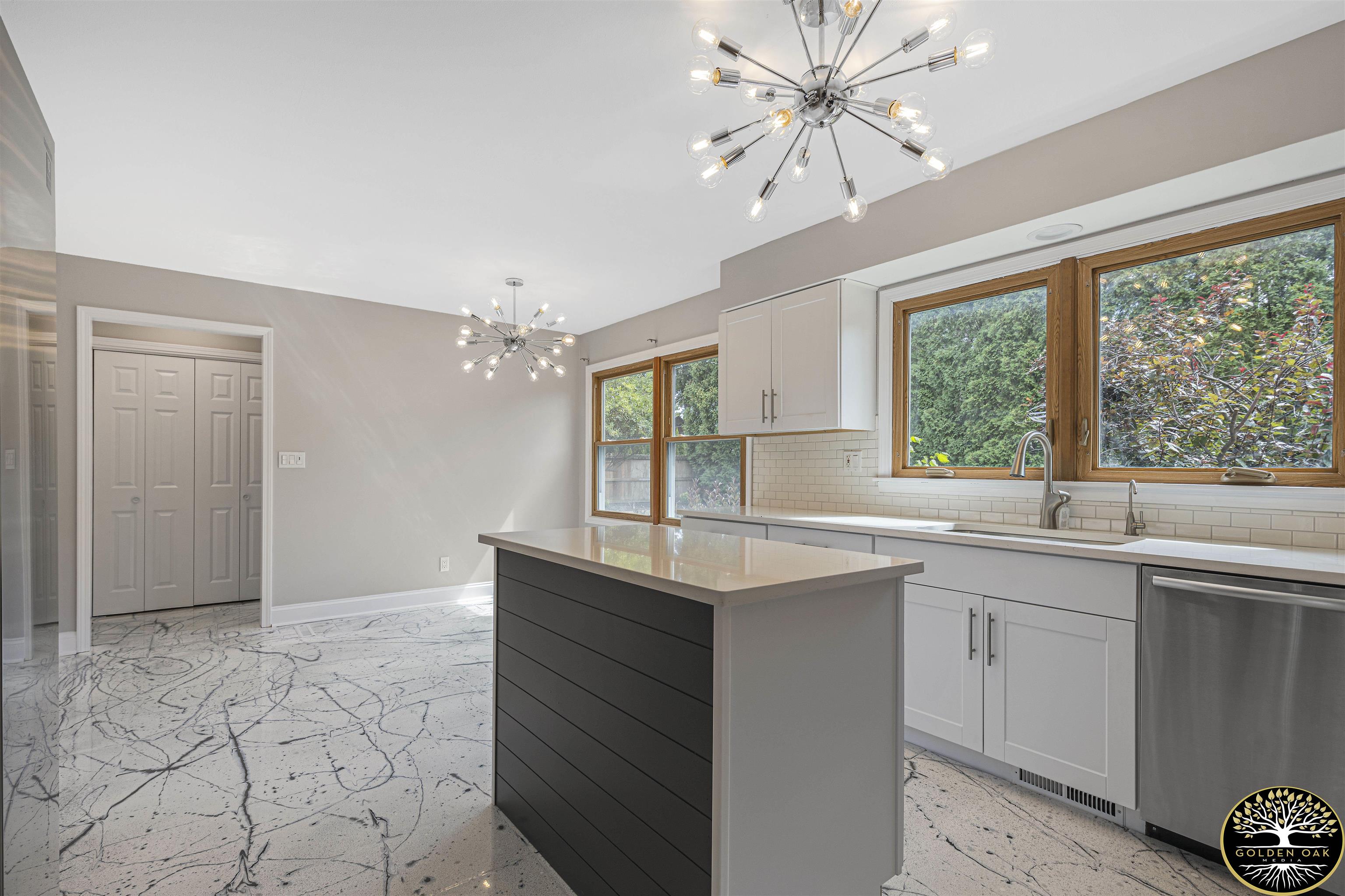 4951 Welsh Road Rockford, IL 61107 - Photo 7 of 45 a kitchen with a sink cabinets and window
