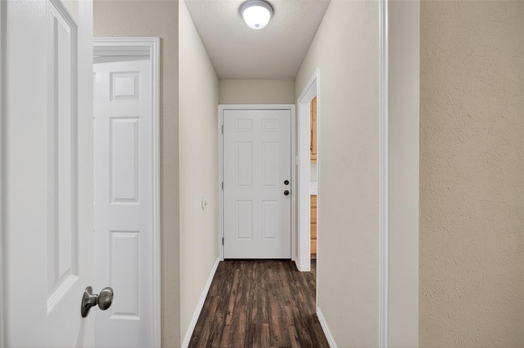 7528 Meadowlark Lane North Watauga, TX 76148 - Photo 2 of 31 a view of a bathroom from a hallway