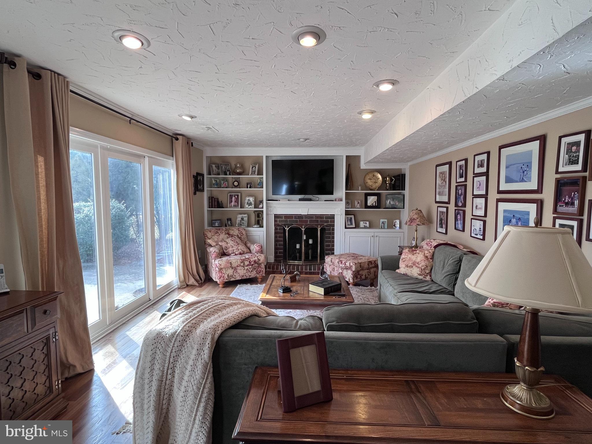 145 Joanne Road Holland, PA 18966 - Photo 15 of 54 a living room with fireplace furniture and a flat screen tv