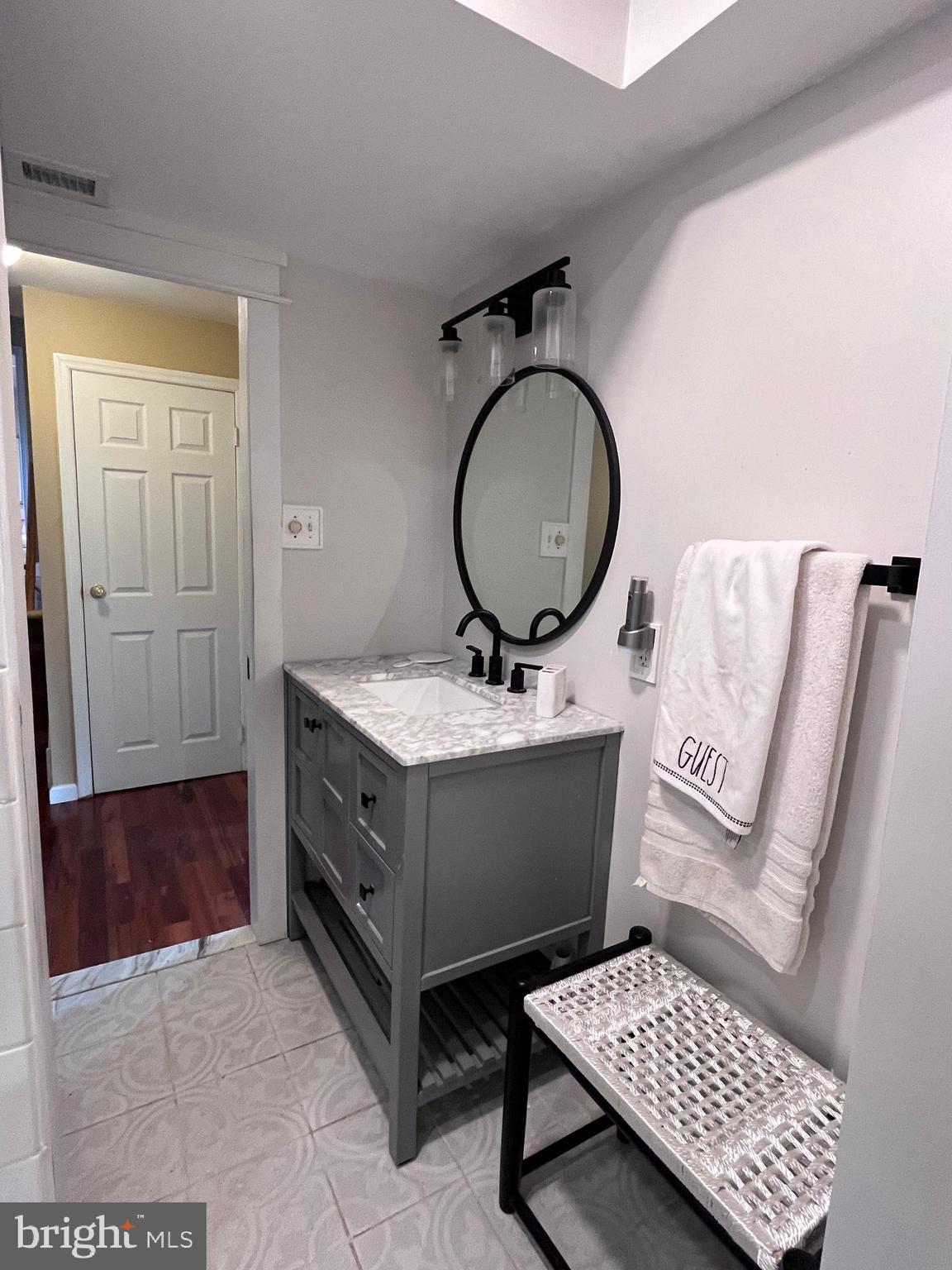 145 Joanne Road Holland, PA 18966 - Photo 17 of 54 a bathroom with a sink and a mirror