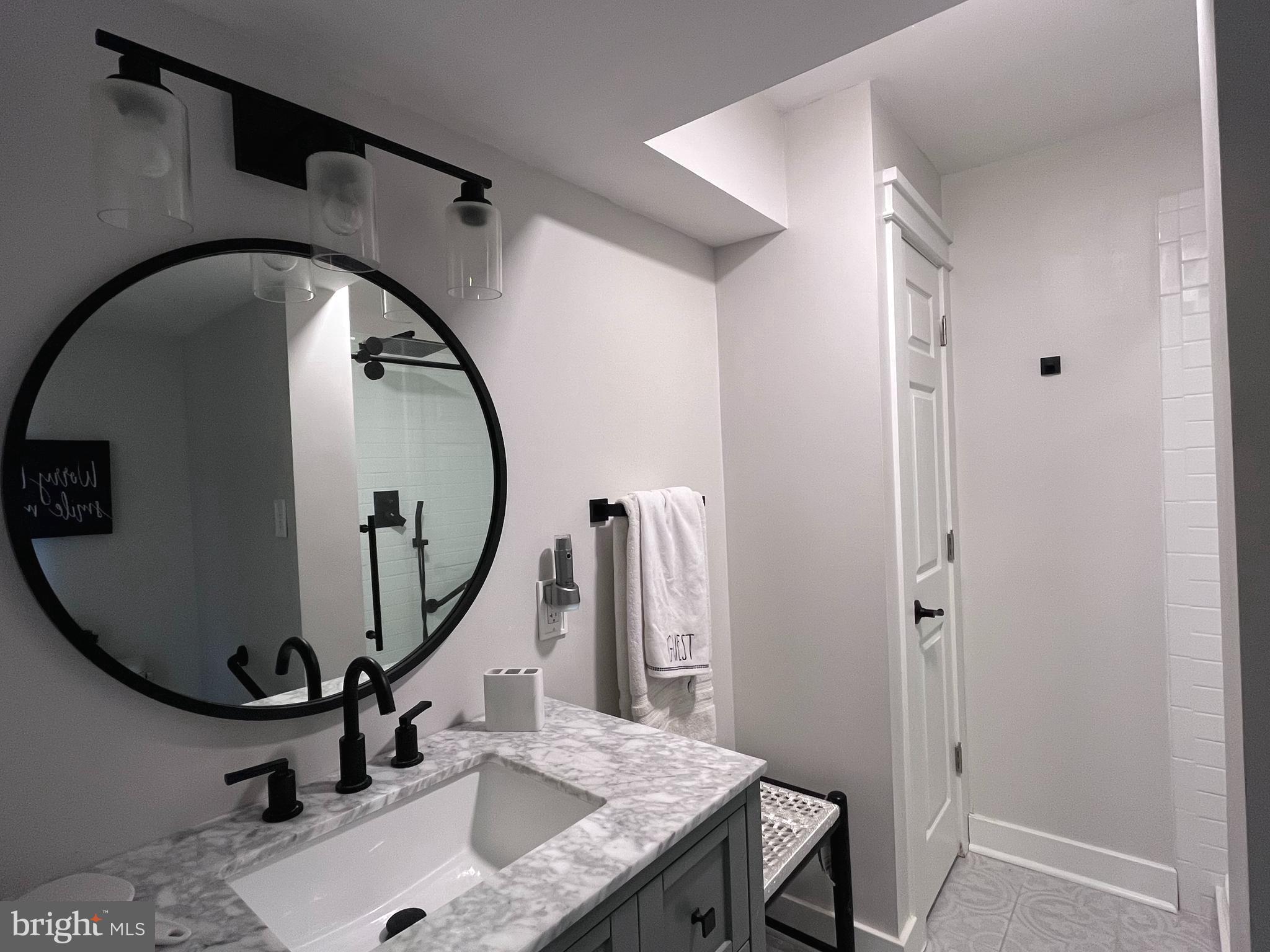 145 Joanne Road Holland, PA 18966 - Photo 18 of 54 a bathroom with a sink a vanity and a mirror