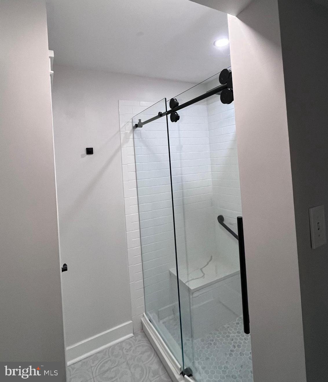 145 Joanne Road Holland, PA 18966 - Photo 21 of 54 a bathroom with a shower and a glass door