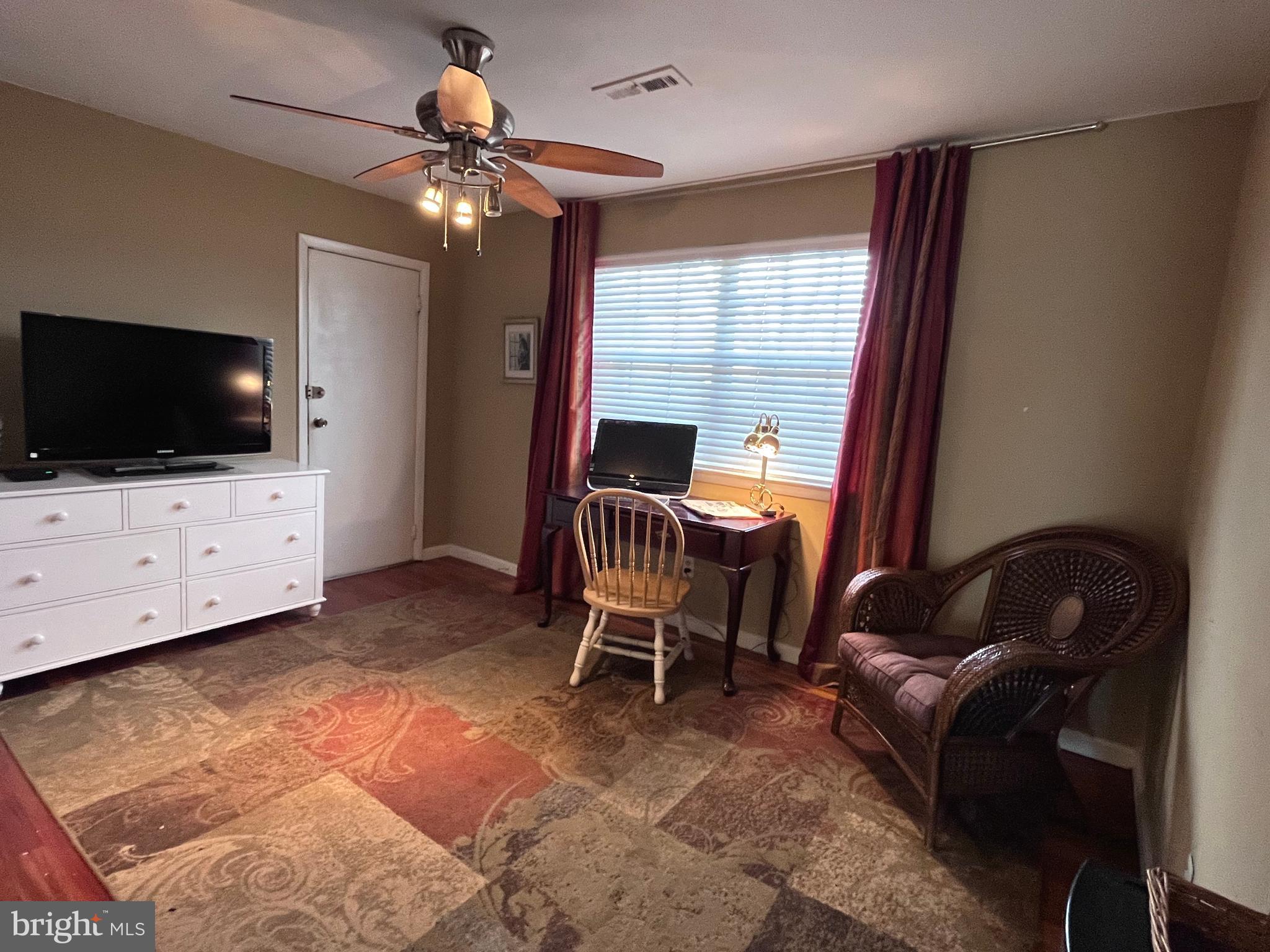 145 Joanne Road Holland, PA 18966 - Photo 23 of 54 a living room with furniture and a flat screen tv