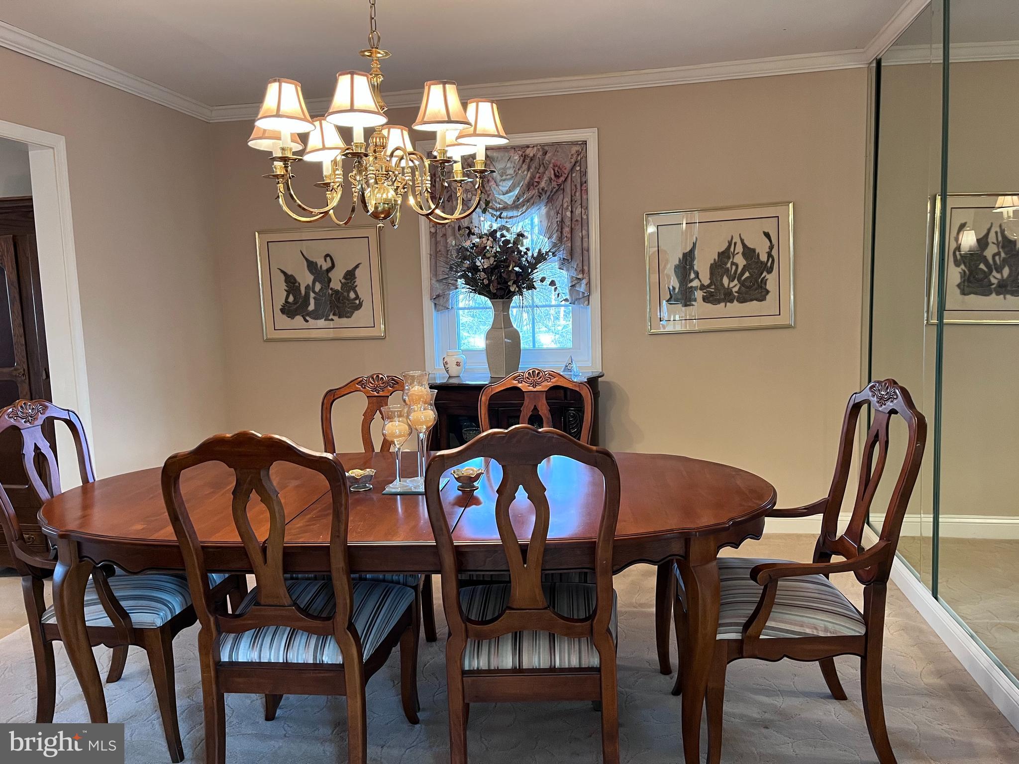 145 Joanne Road Holland, PA 18966 - Photo 29 of 54 a view of a dining room with furniture and chandelier