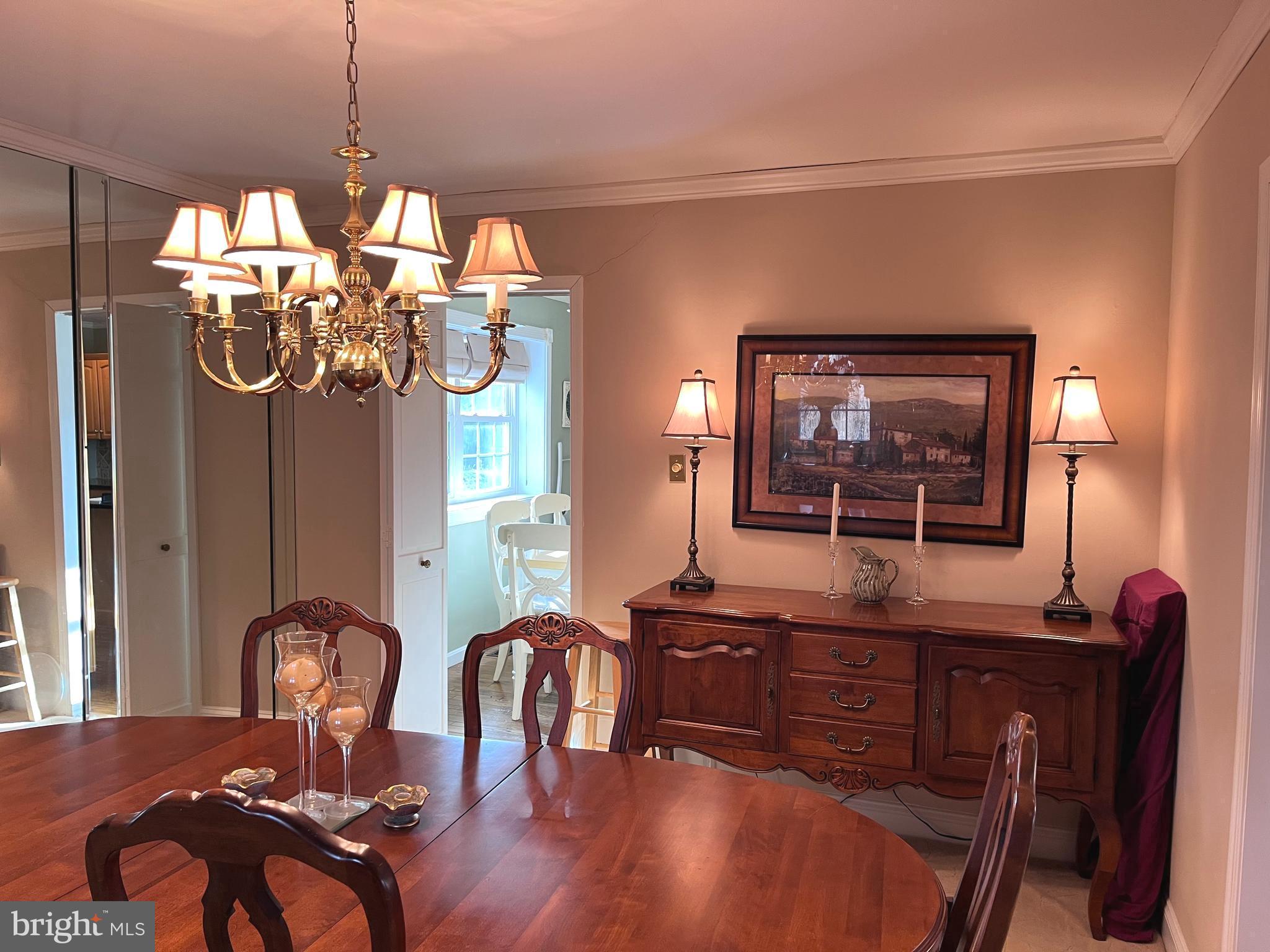 145 Joanne Road Holland, PA 18966 - Photo 31 of 54 a view of a dining room with furniture wooden floor and chandelier