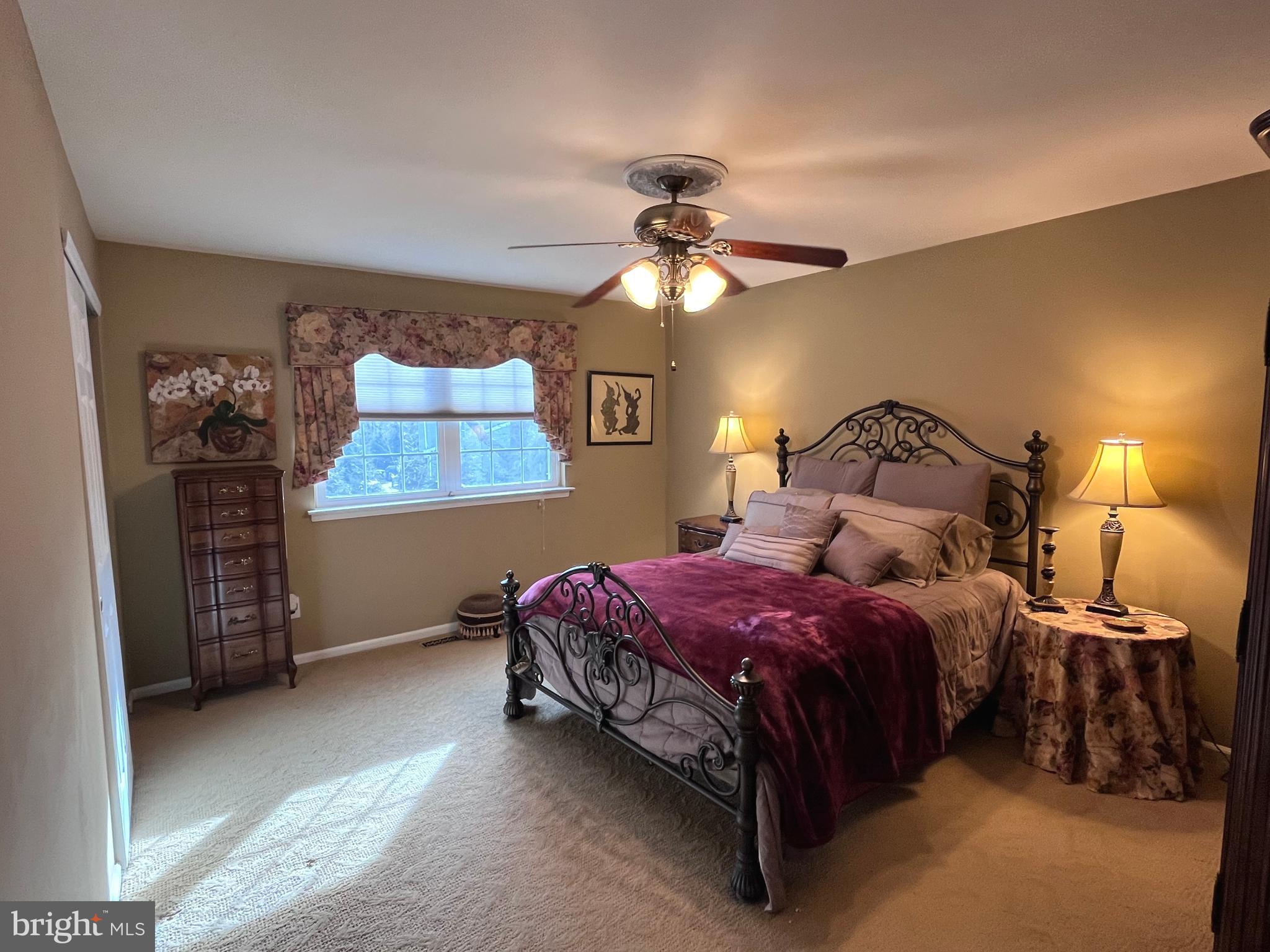 145 Joanne Road Holland, PA 18966 - Photo 33 of 54 a bedroom with a bed and a chandelier